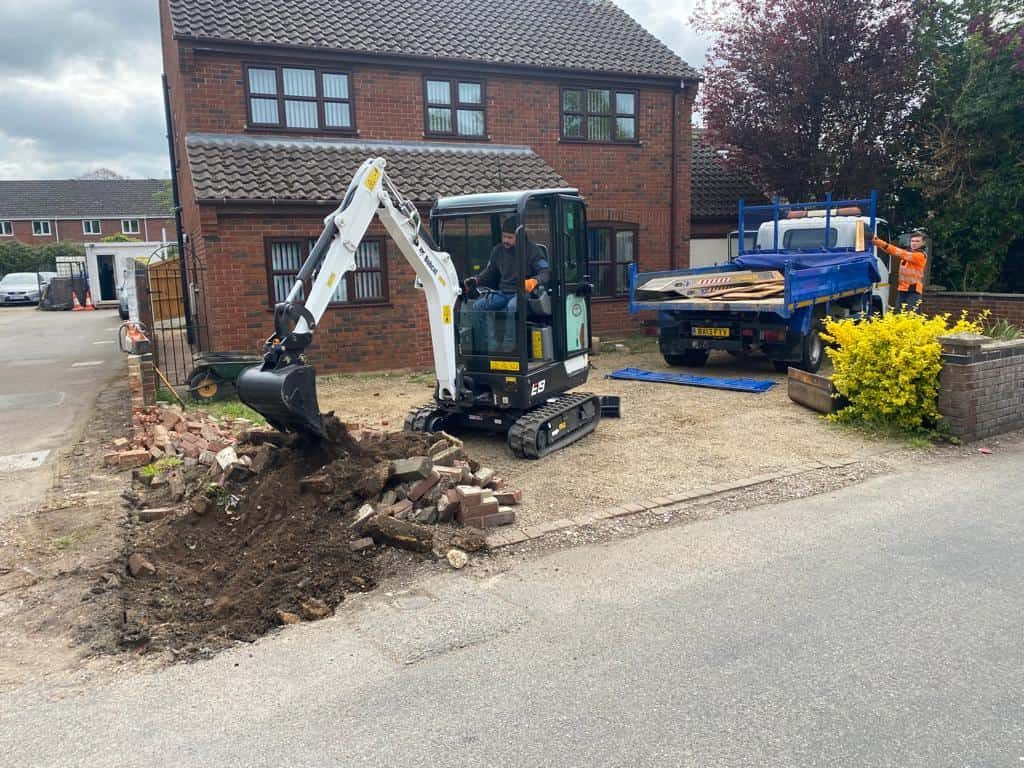 This is a photo of an operative of Attleborough Driveway Services Digging out for a new tarmac driveway