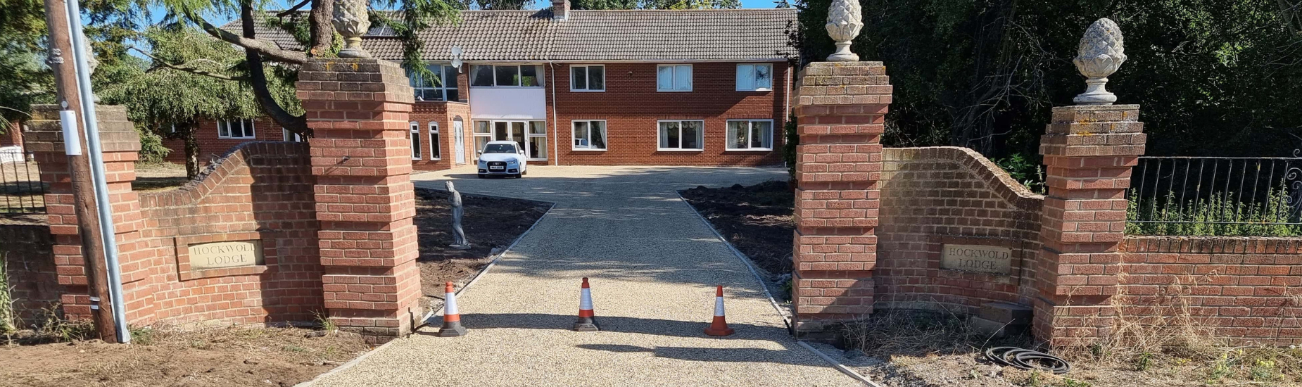 This is a photo of a newly installed tar and chip driveway. Installed by Attleborough Driveway Services