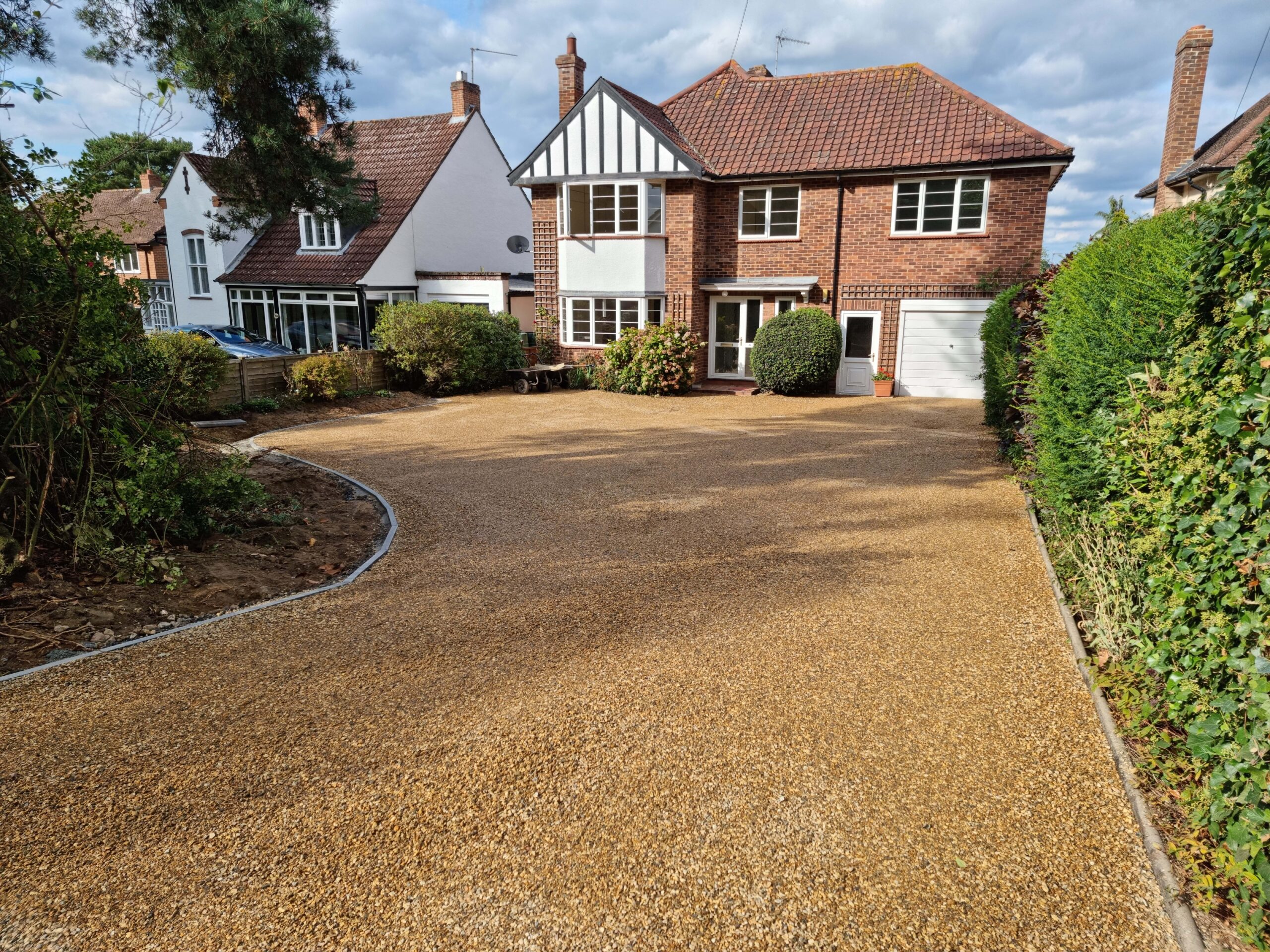 This is a newly installed tar and chip driveway installed by Attleborough Driveway Services